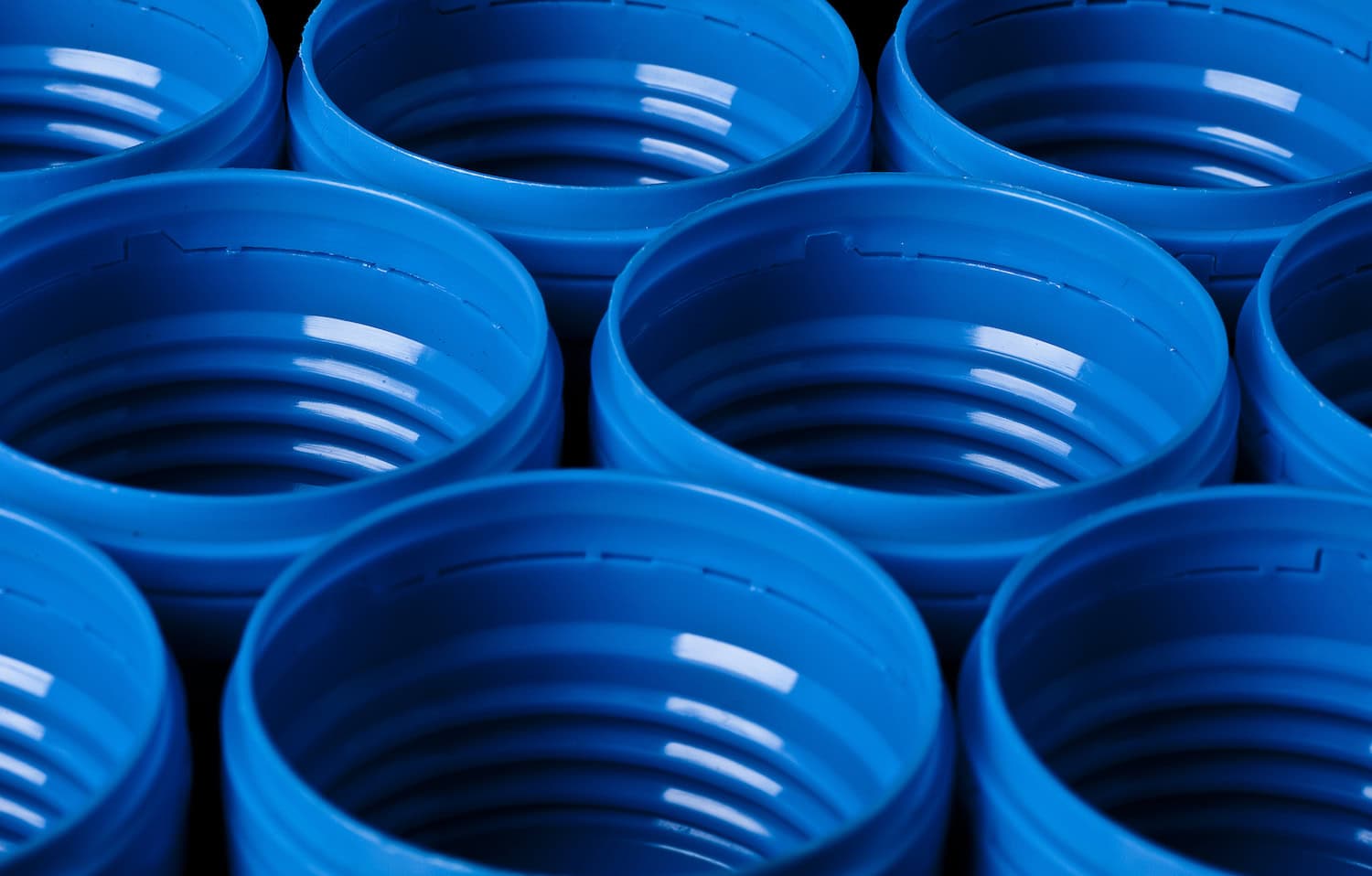 Injection molded blue bottle caps