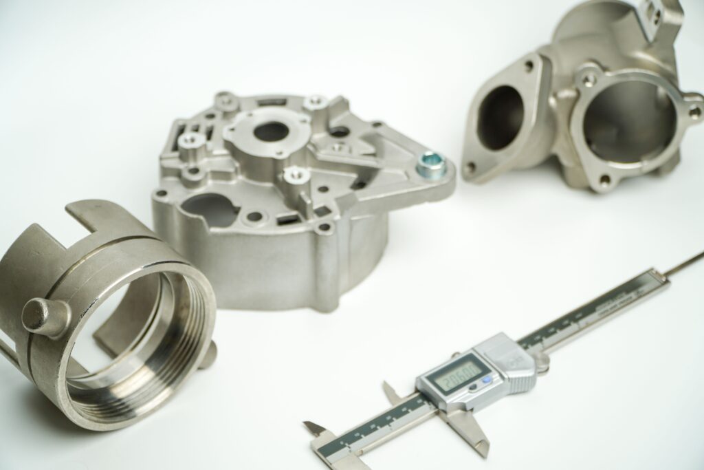 Complex die-cast housing showing integrated cast features and precision post-machined features like internal threads and tight-tolerance bosses.
