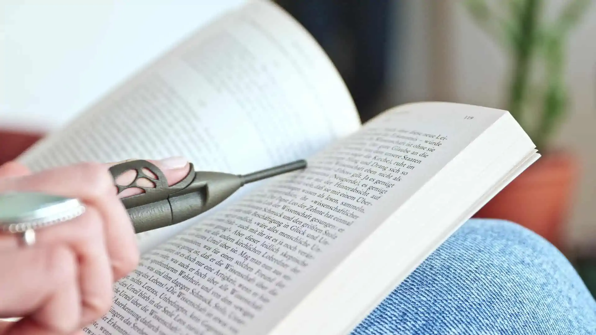 Bookhoover reading tool in use with a book