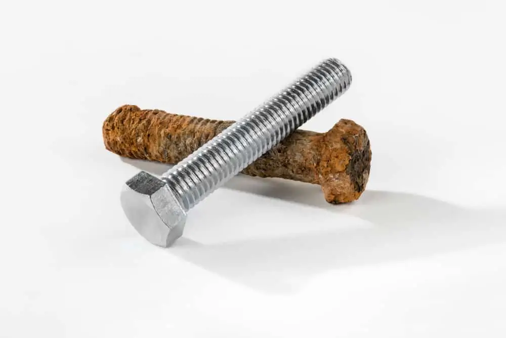 Comparison of a rusted nail and a nail protected against corrosion