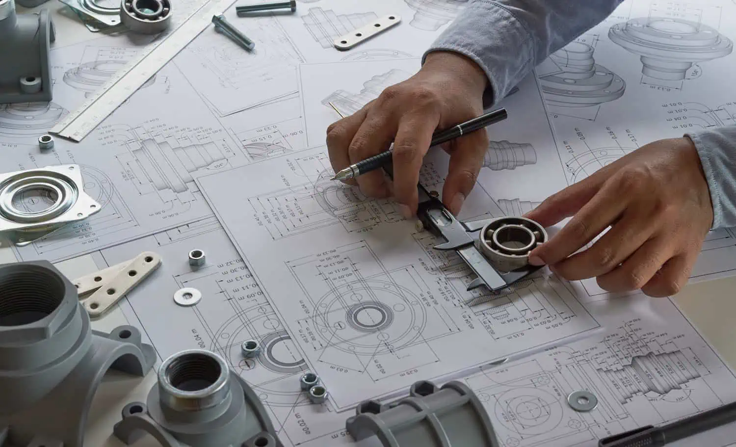 Engineer technician designing drawings mechanical parts