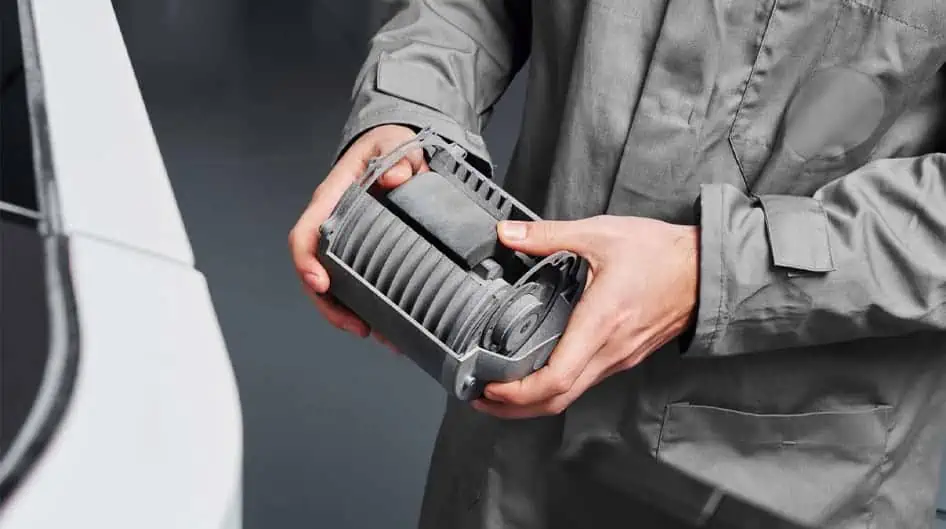 Man holding a part in his hands