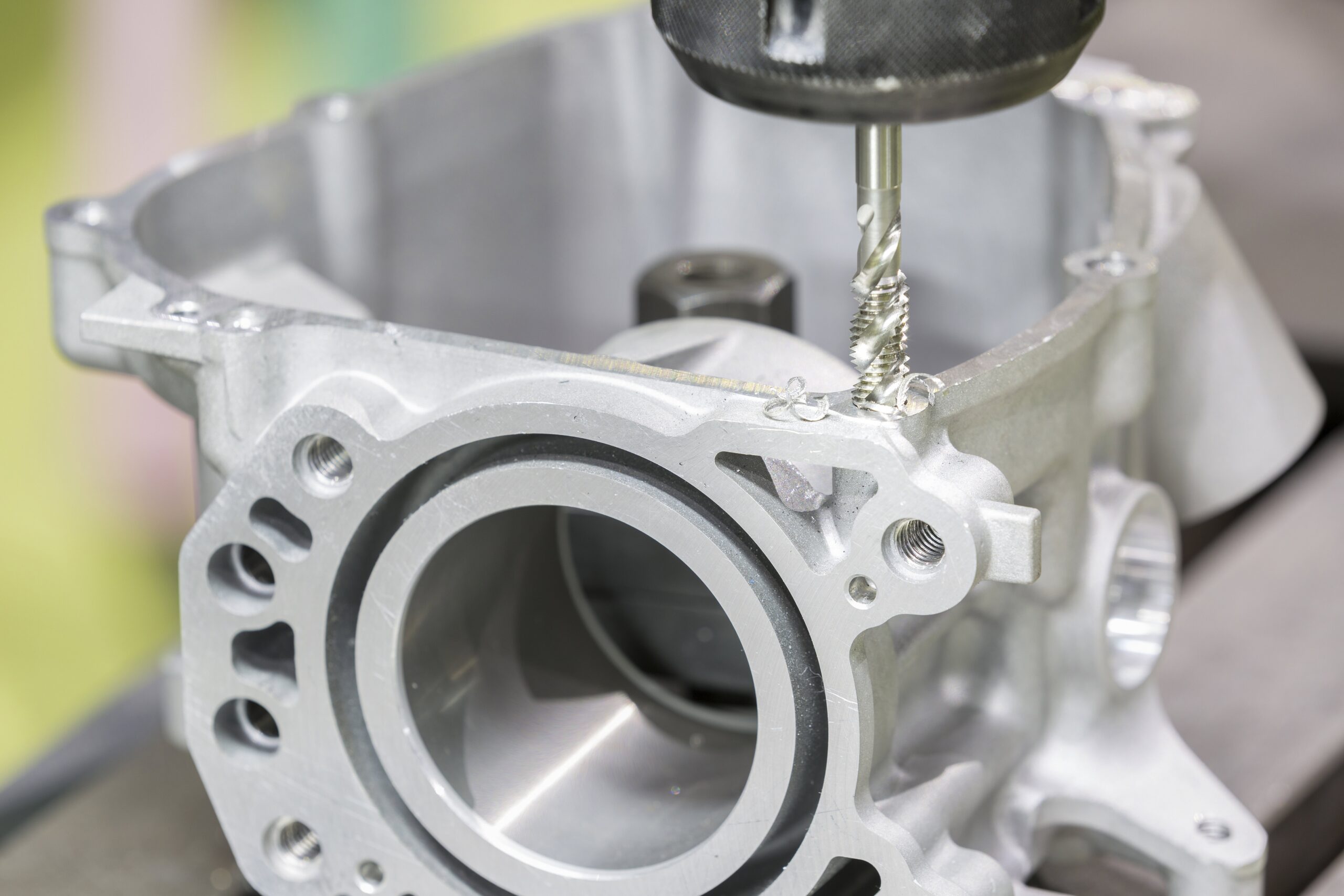 Tapping aluminum automotive part by cnc machining center