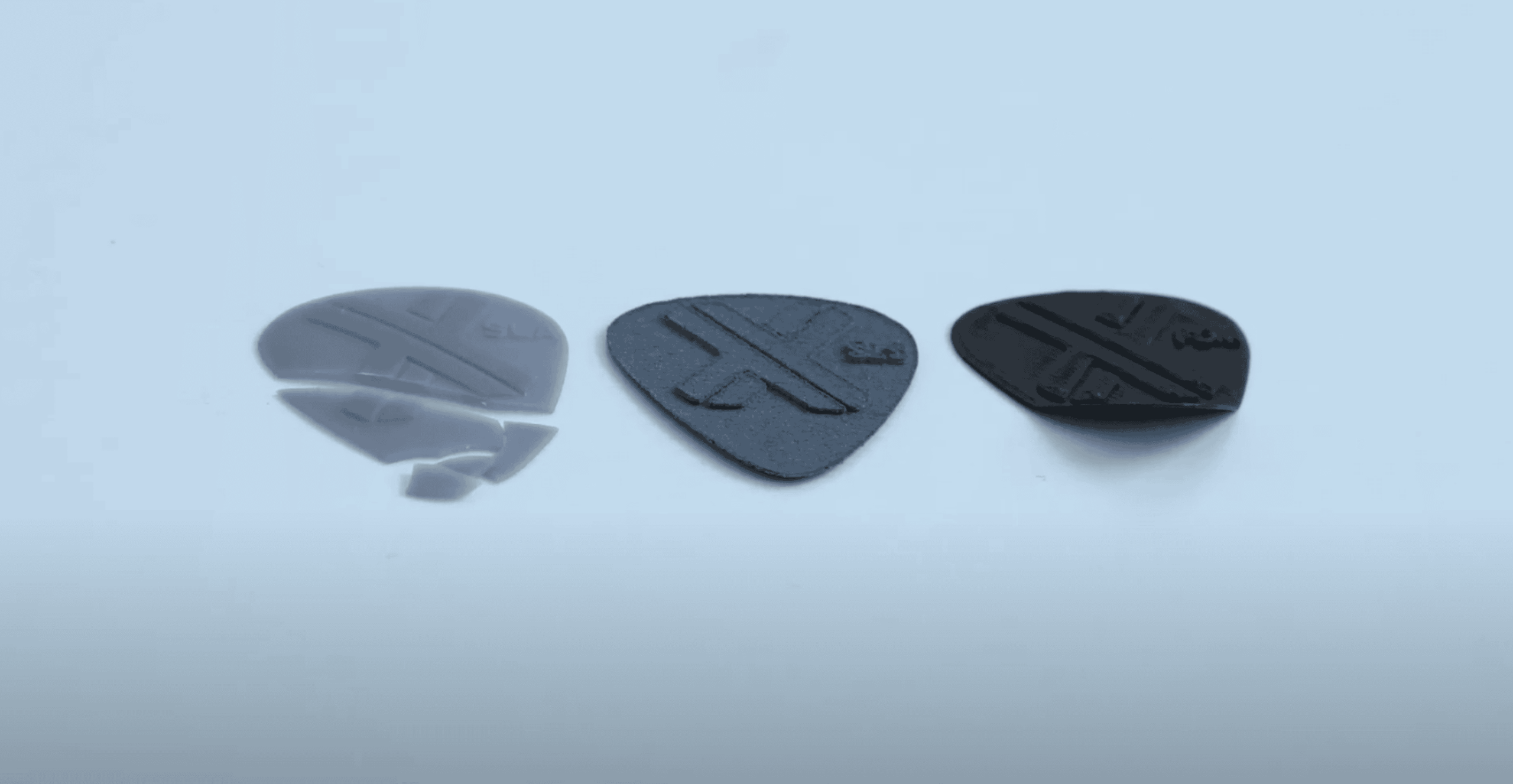 The SLA 0.5 mm broke (left), the SLS 0.5 mm pick kept its shape, and the FDM 0.5 mm heavily deformed