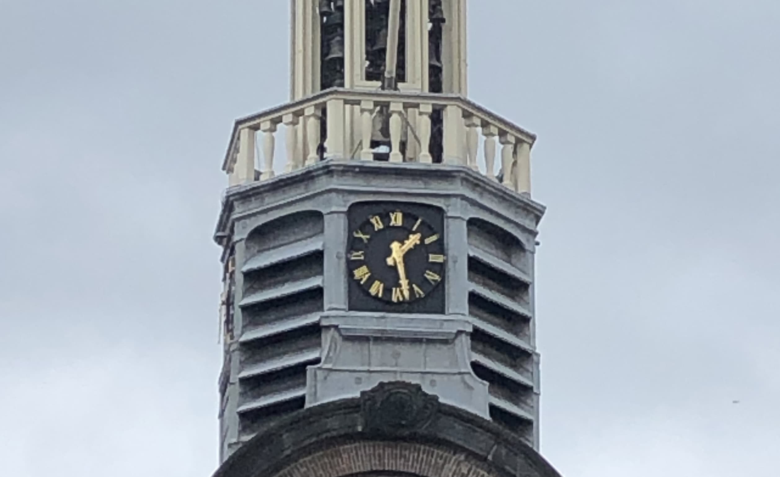 The Pilgrim Fathers Church near Rotterdam, featuring both a clock and a sundial—a historical tradition for accurate timekeeping.