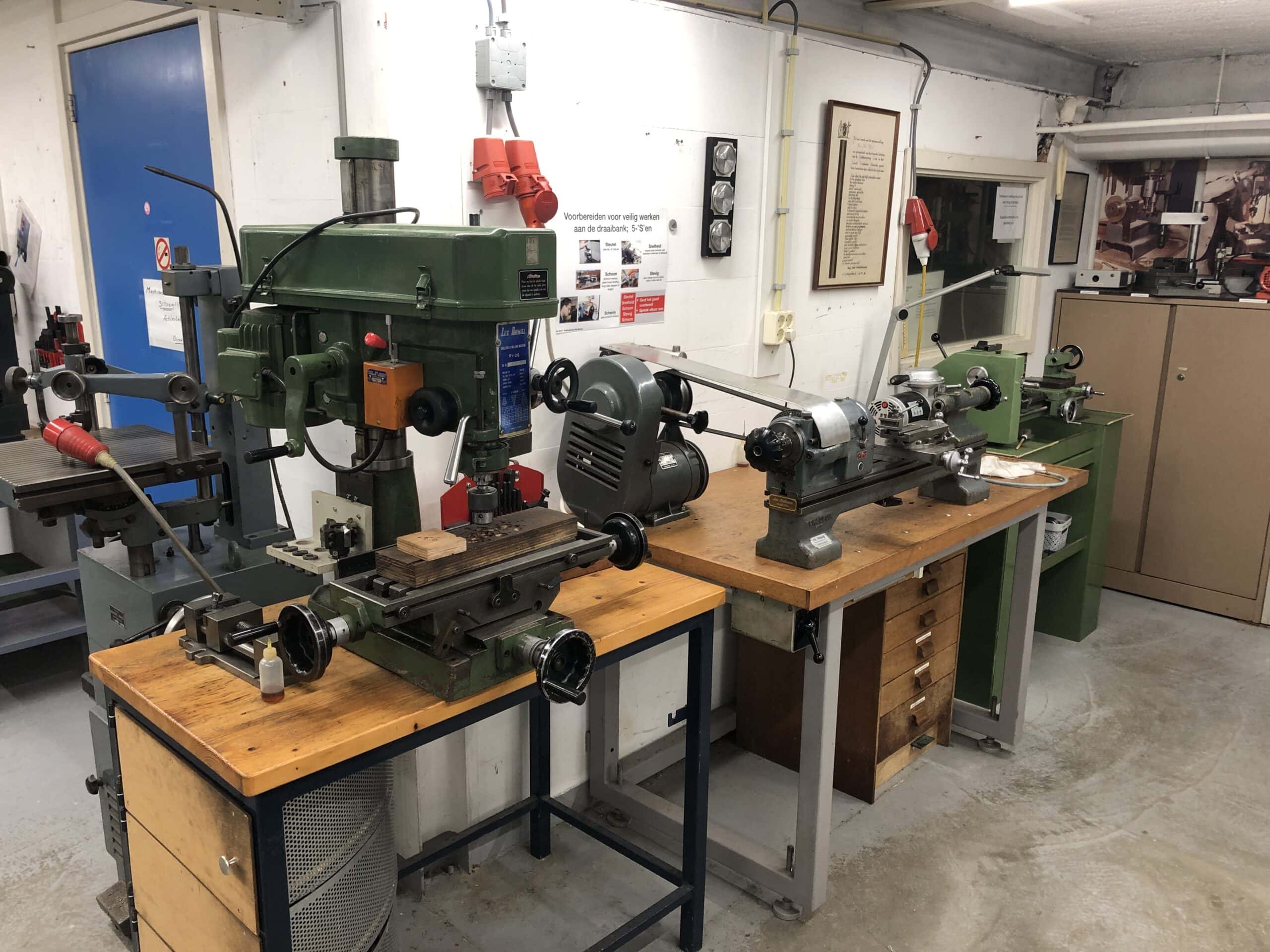 Precision milling machines in the society’s workshop, used for crafting intricate clock components.