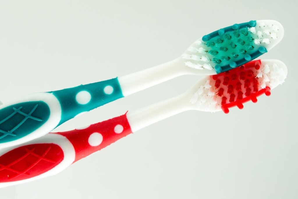 Close-up of toothbrushes with overmolded grips and bristles in contrasting colors
