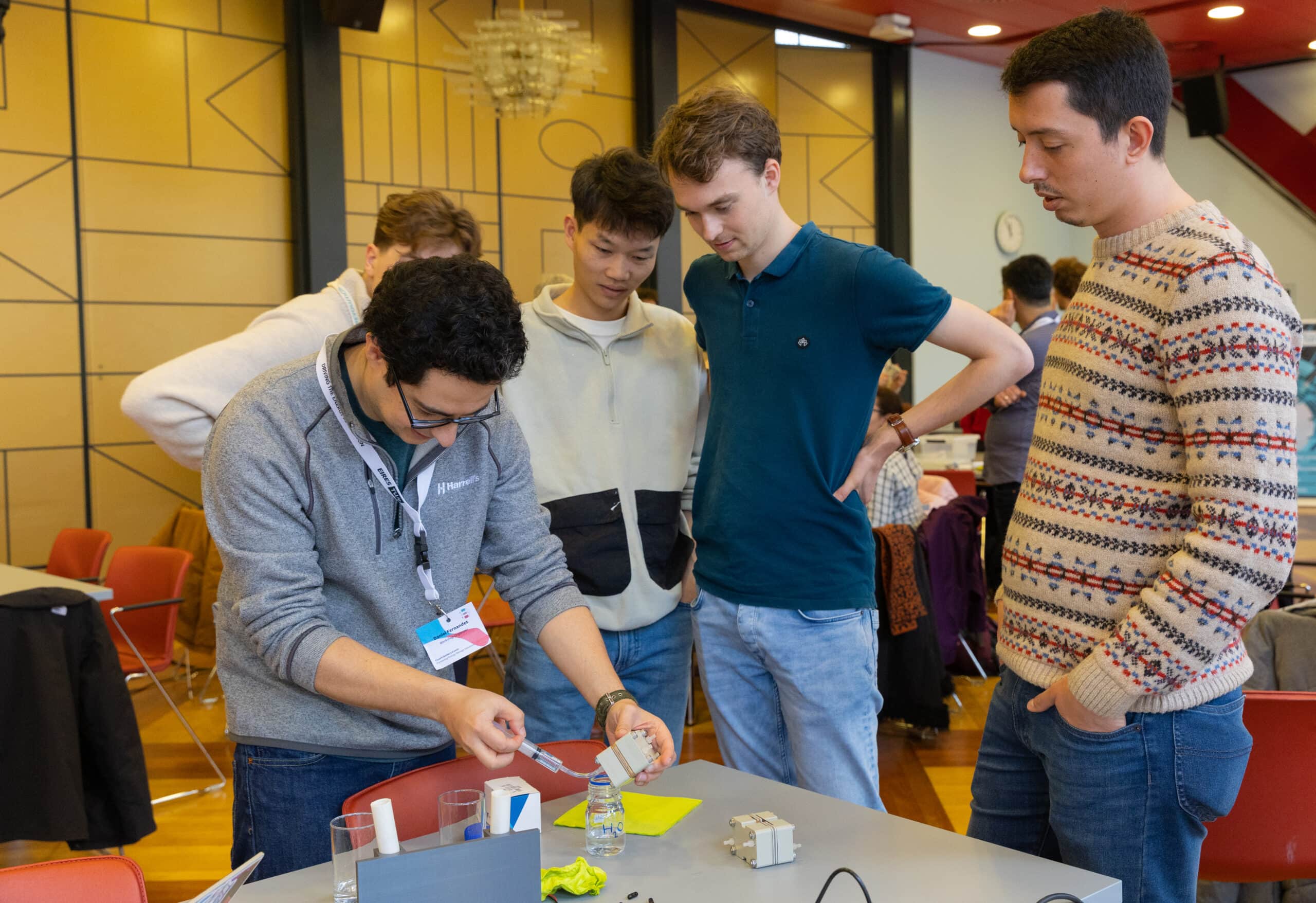 Manually pumping water through an assembled cell to test for leaks