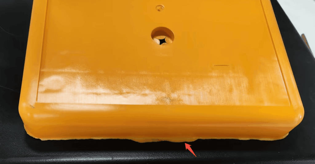 Example of flash defect in injection molding