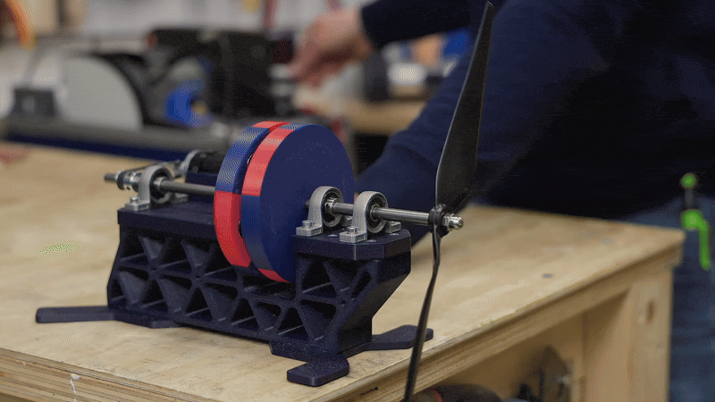 Assembling the magnetic coupler — magnets face each other in alternating polarity.©
