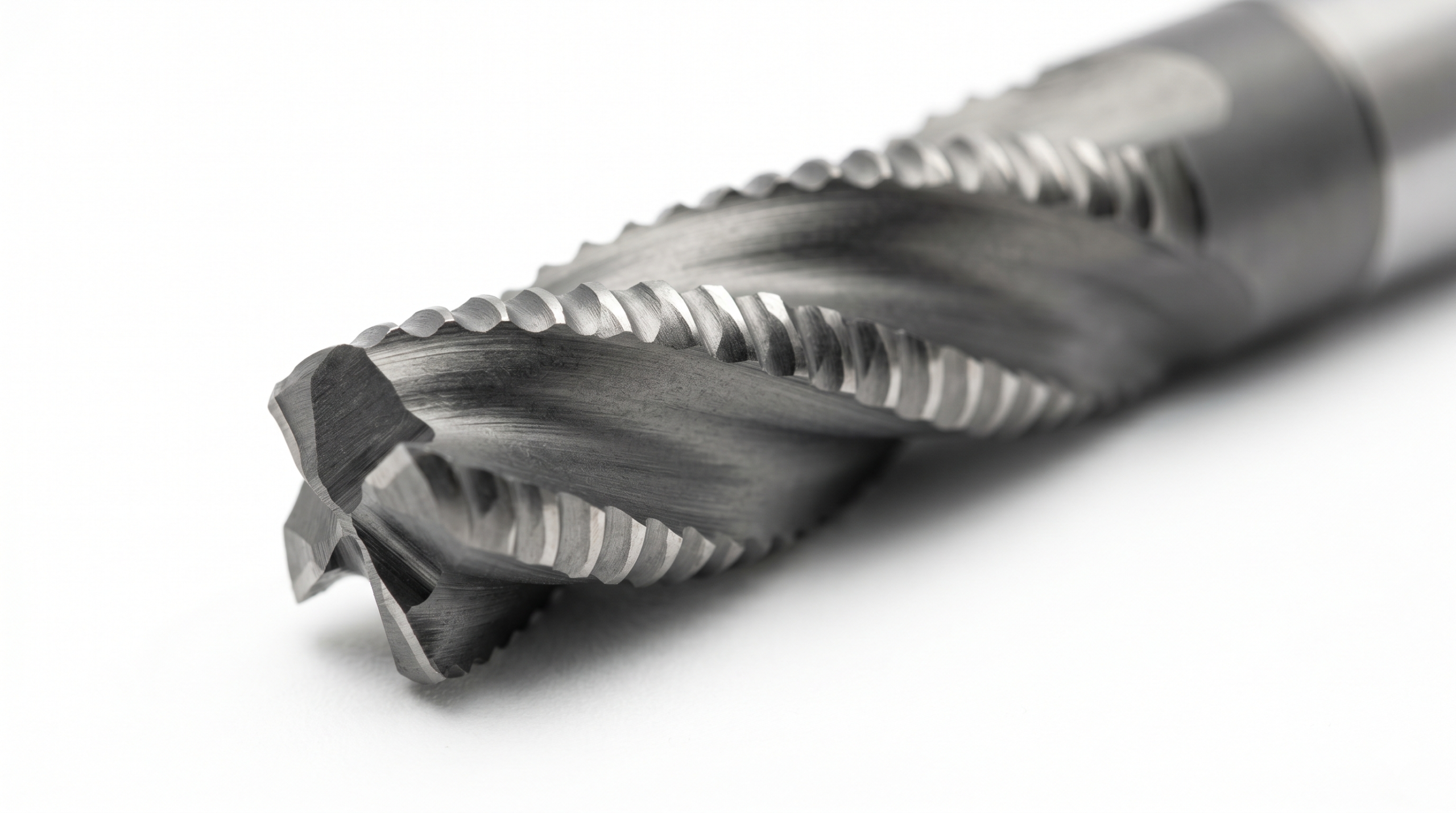 Solid carbide roughing end mill with serrated chip-breaking profile along the cutting edges.